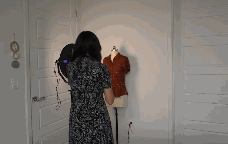gif of trying different outfits on a mannequin and taking pictures